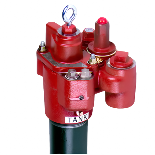 This image shows a close-up of the Red Jacket submersible turbine pump (STP) head. Key features:  1. Predominantly red metal construction 2. Central cylinder with silver lifting hook 3. Multiple ports and fittings 4. "TANK" label visible 5. Various bolts and valves 6. Small section of black pump shaft visible below  This pump head is designed for use in underground fuel storage systems, with its complex assembly of components allowing for efficient fuel transfer and system management.